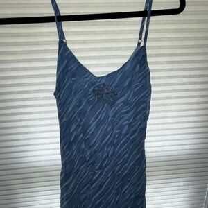 Blue spaghetti strap dress with single flower on chest + faux fur trim